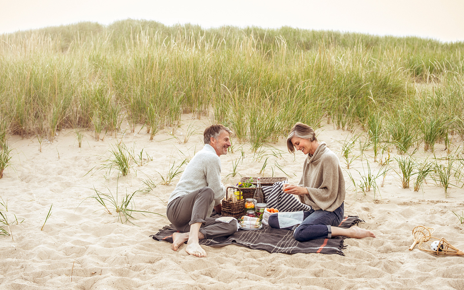 Couple having a picnic on the white sandy beach at Lake Michigan