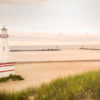 A lighthouse on New Buffalo beach near The Harbor Grand - one of many places to explore nearby