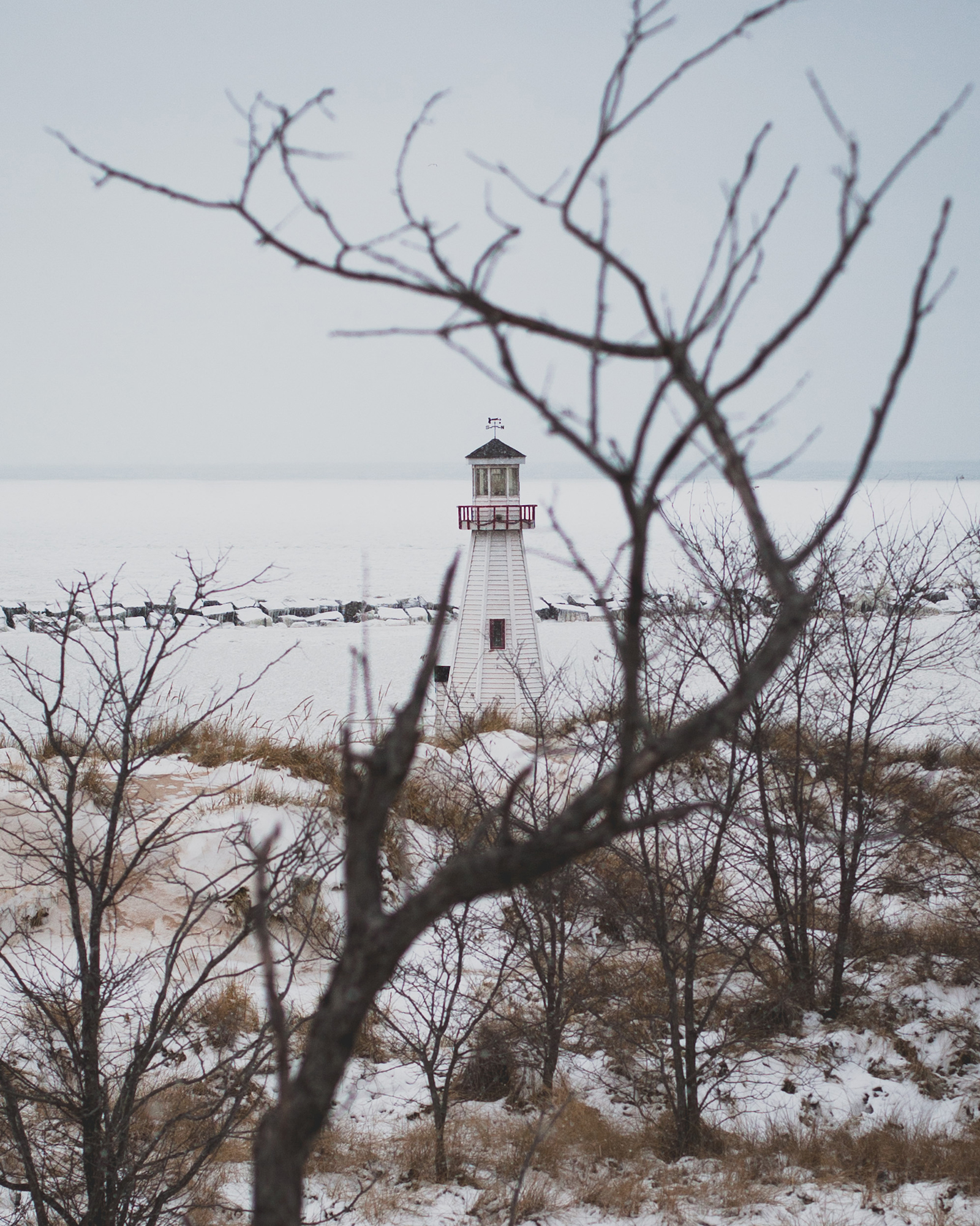 New-Buffalo-lighthouse-winter winter view of New Buffalo lighthouse through bare branches